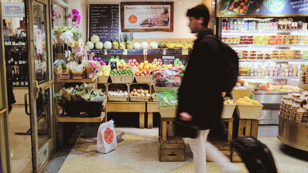 A man is shopping in a grocery store.
