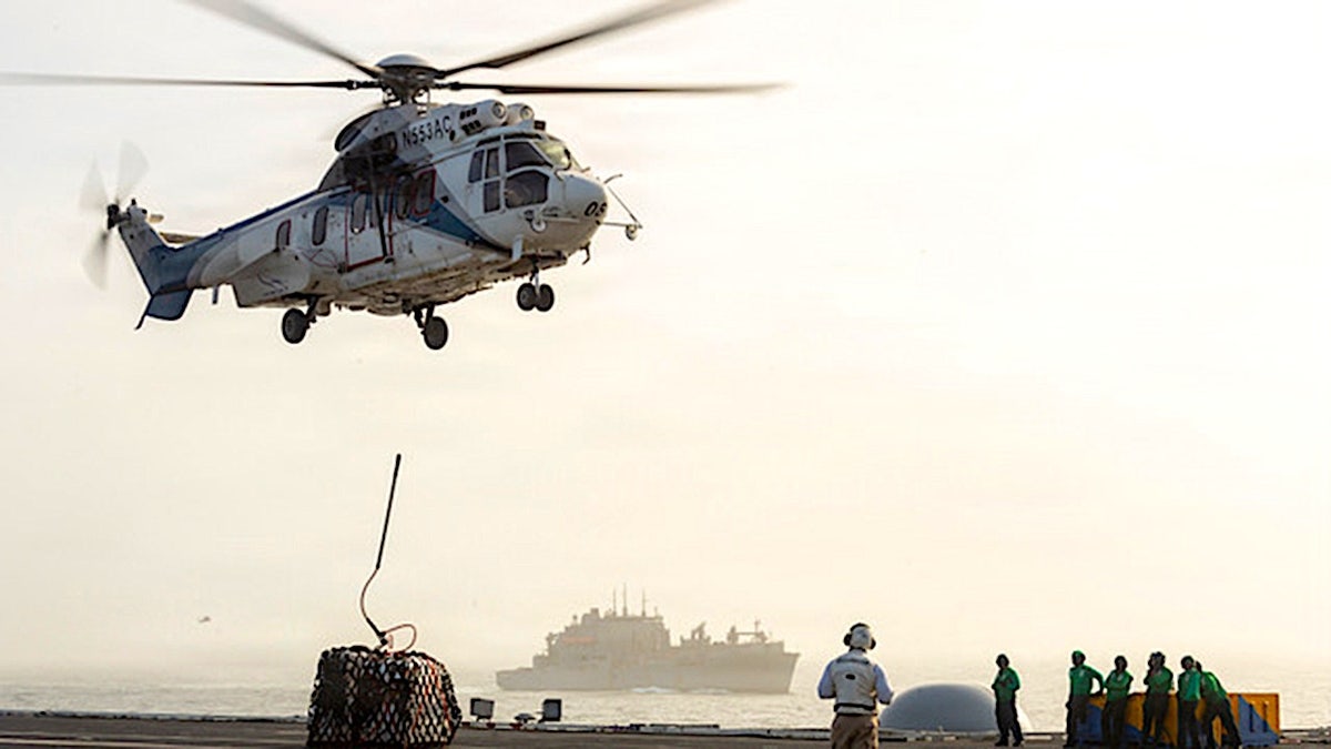 Helicopter above USS George Washington