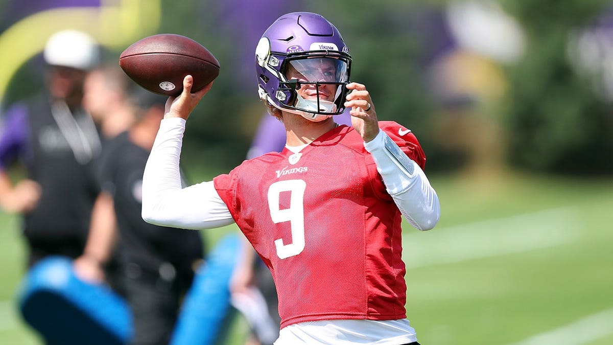 J.J. McCarthy, wearing Minnesota Vikings uniform number 9, participates in a drill.