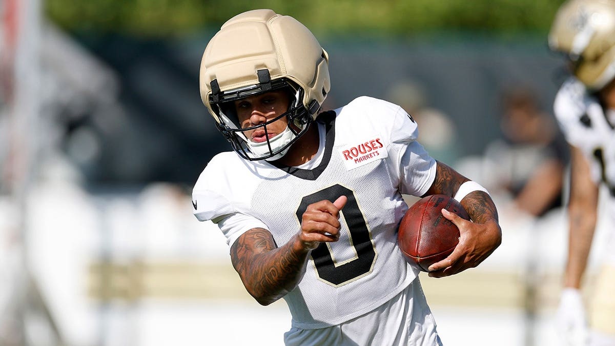 Jordyn Tyson, number 0, participates in drills during a joint practice.