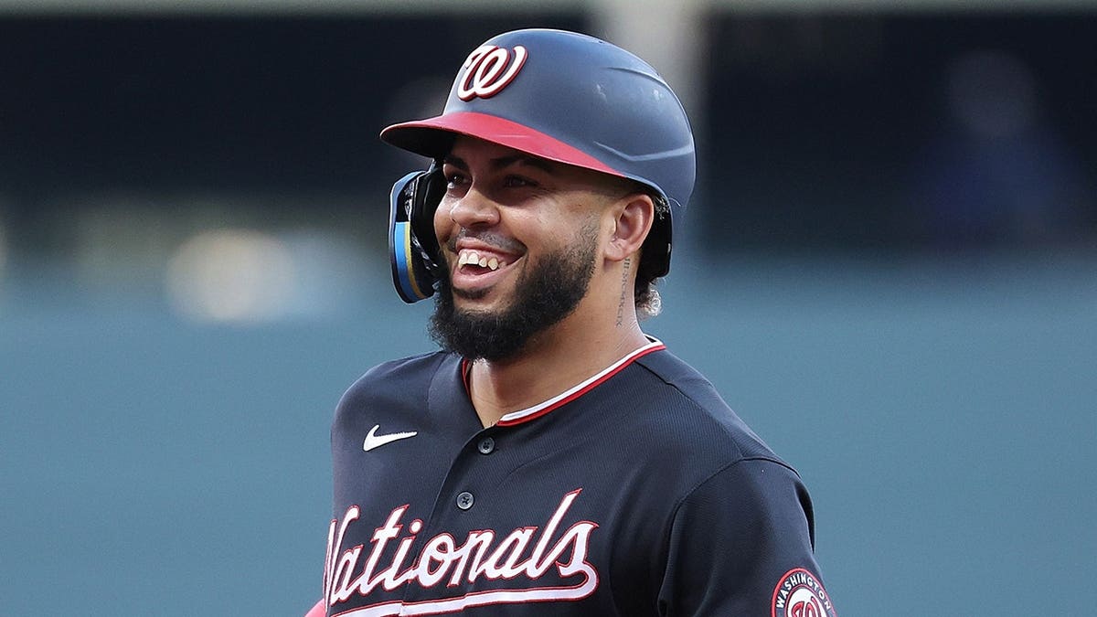 Luis García Jr. reacts as he rounds third base after hitting a solo home run.