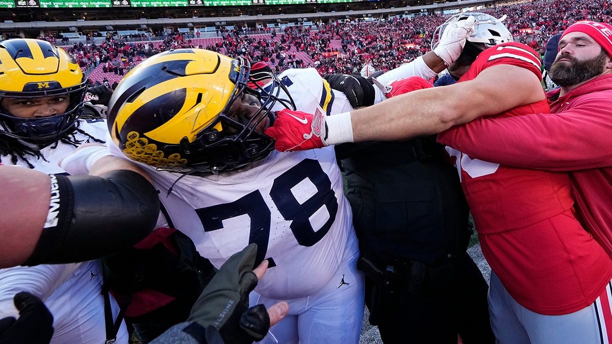Michigan OSU players fighting