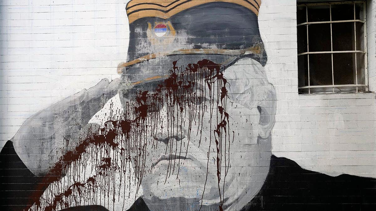Ratko Mladic mural vandalized with paint in Belgrade, Serbia.