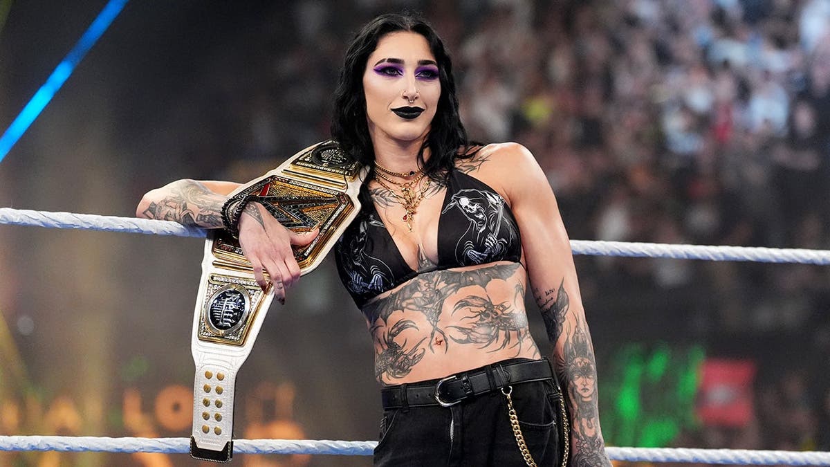 Rhea Ripley, WWE Women's Champion, stands in the ring at Olimpic Arena.