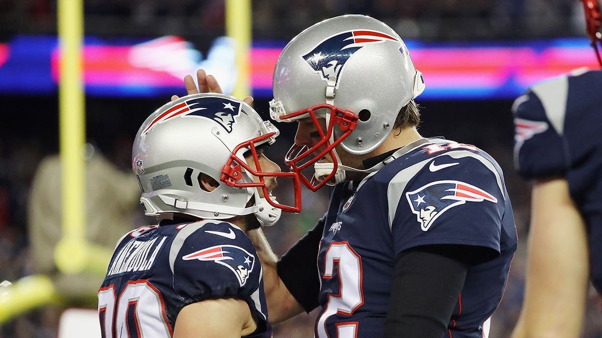 Tom Brady and Danny Amendola celebrate a touchdown during an AFC Championship Game.