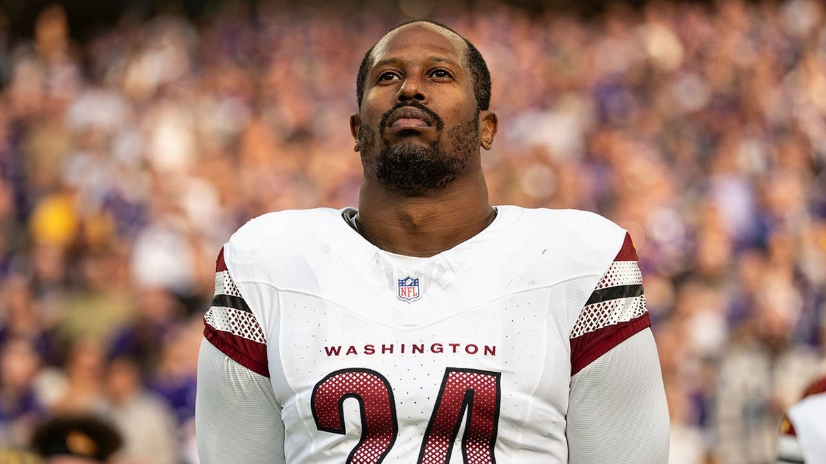 Von Miller #24 of the Washington Commanders looks on during an NFL game at U.S. Bank Stadium.
