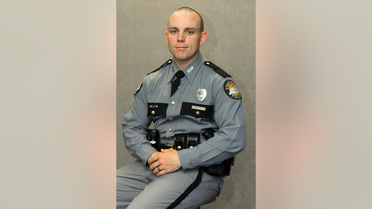 Kentucky State Police Trooper Hayden Phillips poses for a portrait in uniform