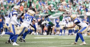 Stevens scores 3 TDs as Riders beat Bombers in OT
