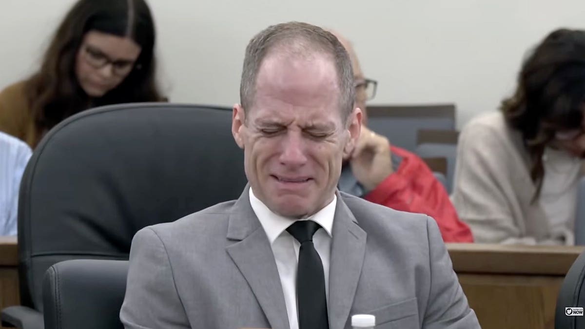 Caleb Flynn becomes emotional in court during his murder trial in Ohio.