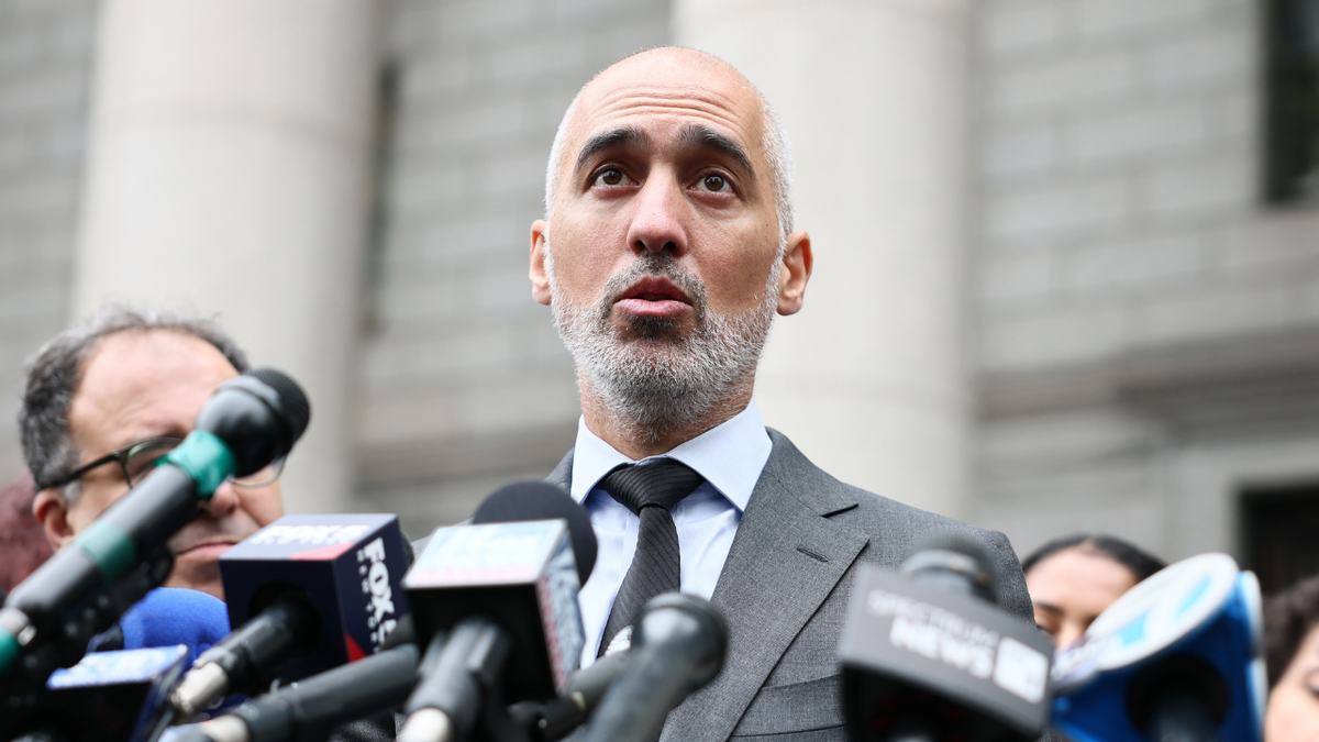 Ramzi Kassem is seen speaking to reporters in New York City.