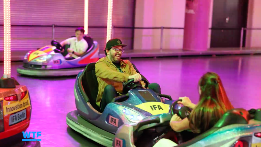 The writer gleefully riding an IFA bumper car.