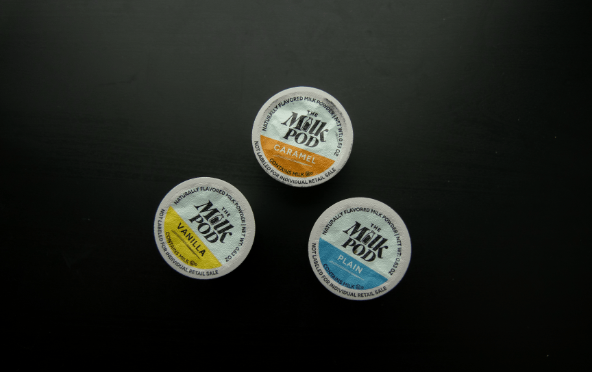 three milk pods on table