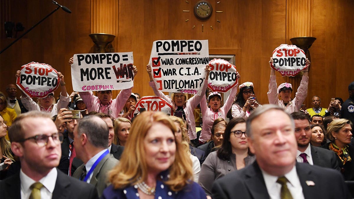 CodePink activists protest during Mike Pompeo's Senate confirmation hearing in Washington, D.C.