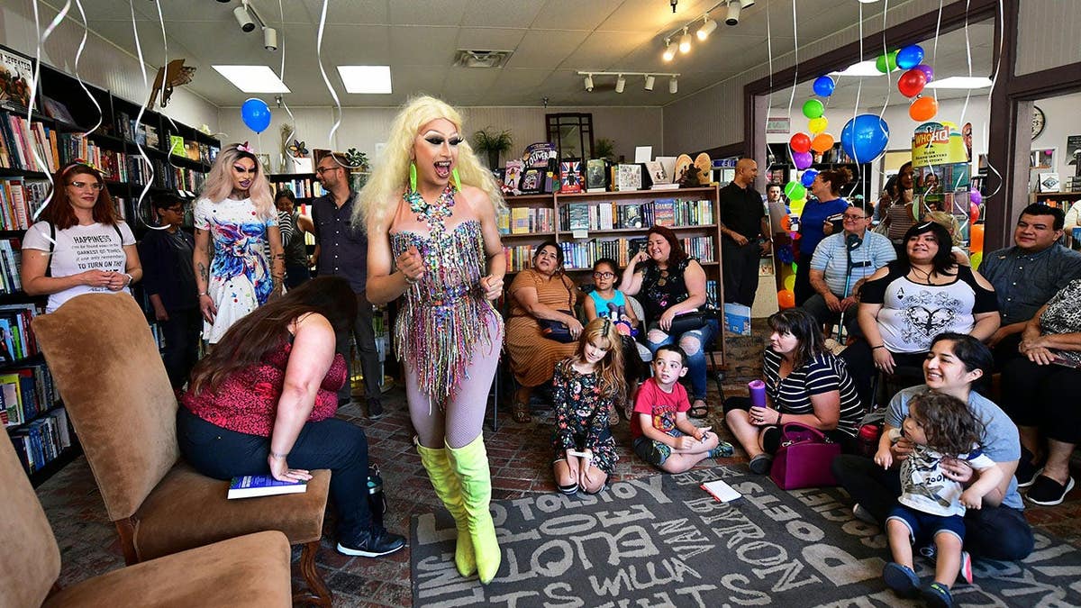 Drag queens Athena Kills and Scalene Onixxx arrive at Cellar Door Books in Riverside, Calif.