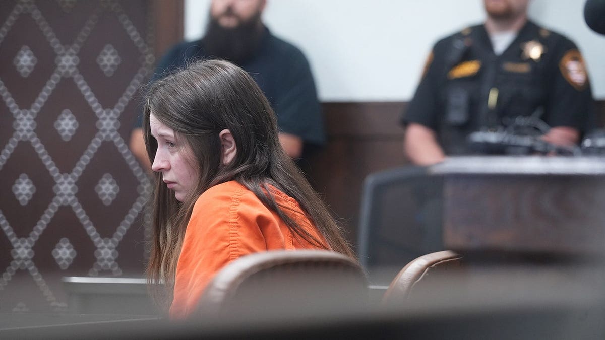 Elizabeth Siders, 34, stands in court during her arraignment.