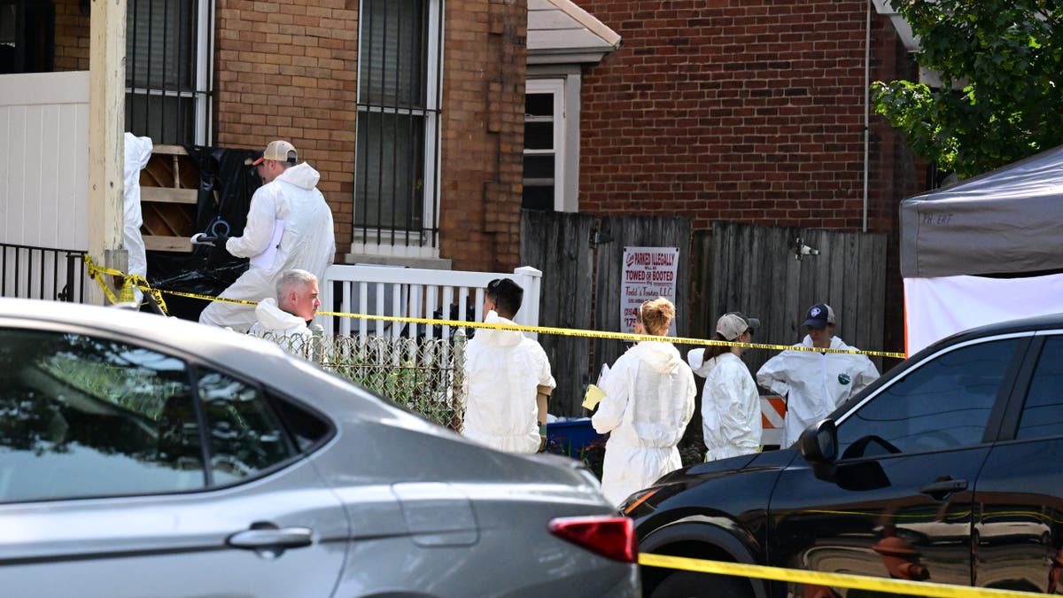 FBI agents execute a search warrant at Eugene Horsch's home in Philadelphia.
