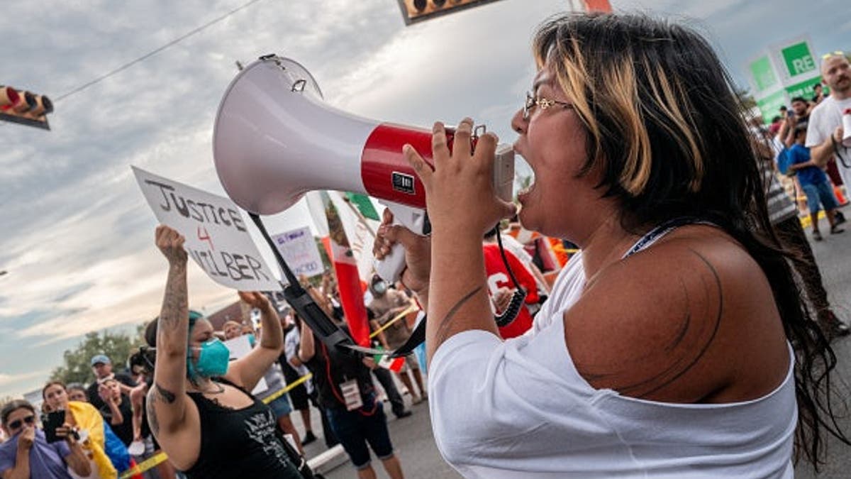 Protesters demonstrate against ICE officers in Austin, Texas.