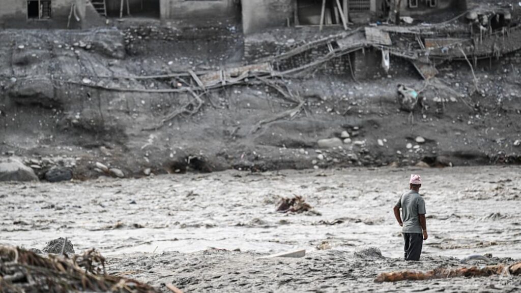 Nepal’s riverside communities cling to hope with loved ones missing after deadly flood