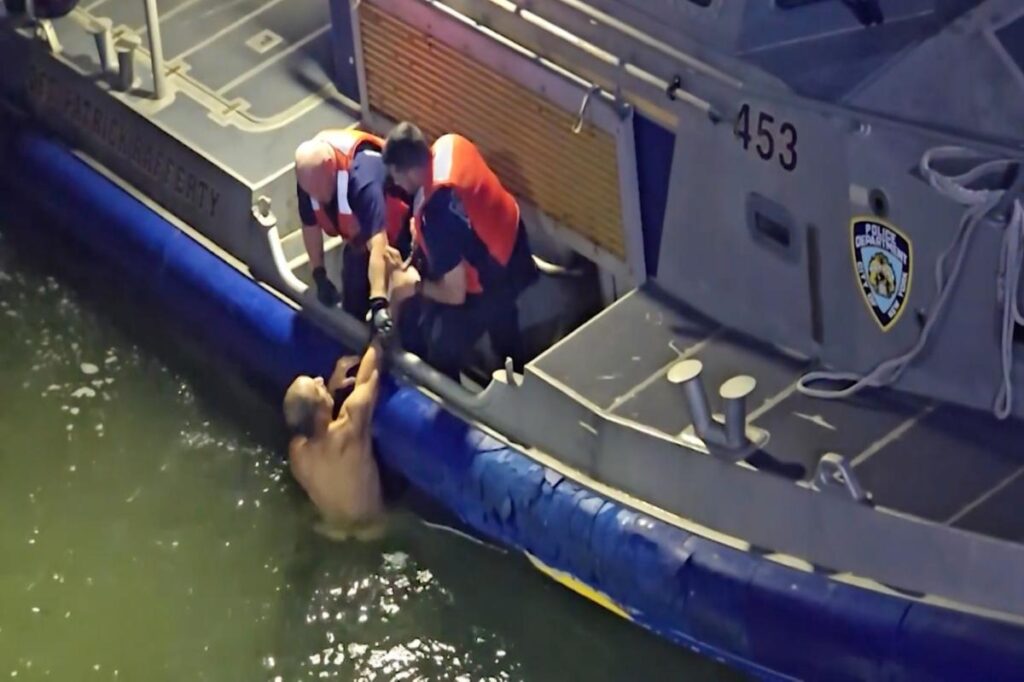 Dramatic video shows naked man being pulled from East River by NYPD