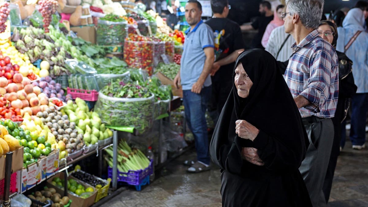 People shop for produce at Tajrish bazaar in northern Tehran.