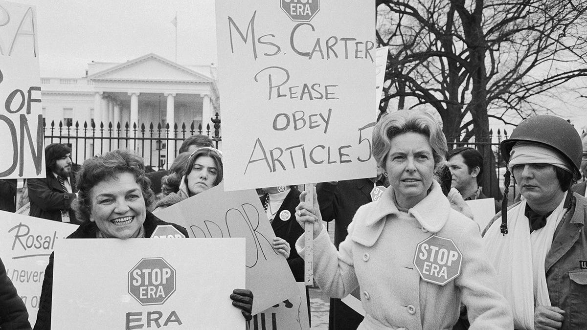 Phyllis Schlafly stands outside the White House during a demonstration.