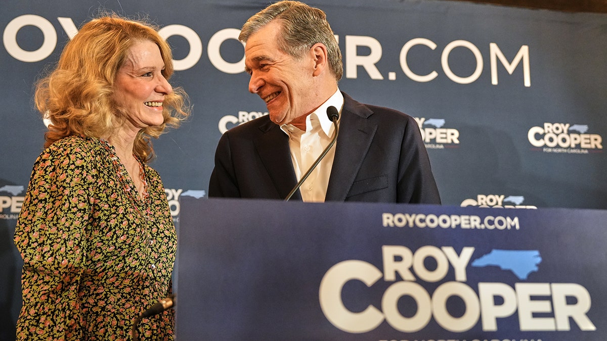 Roy Cooper and his wife, Kristin Cooper, together at a primary election night watch party in Raleigh, North Carolina.