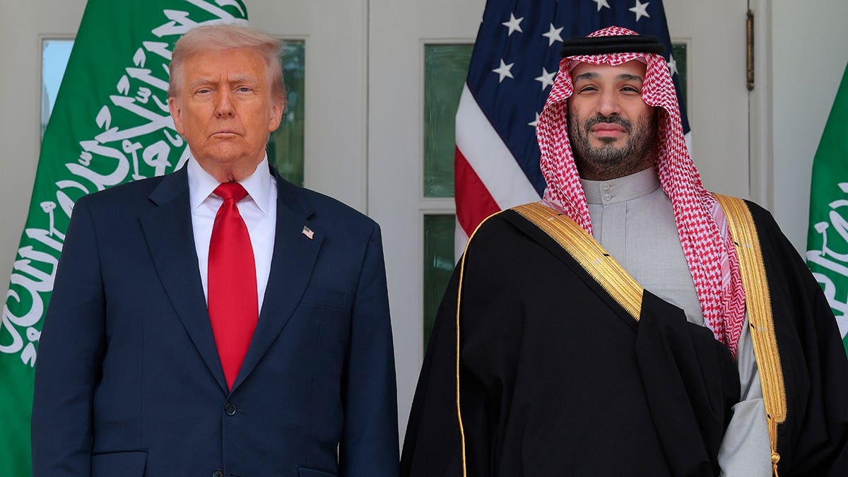 President Donald Trump and Crown Prince Mohammed bin Salman pause for photographs along the West Wing Colonnade.