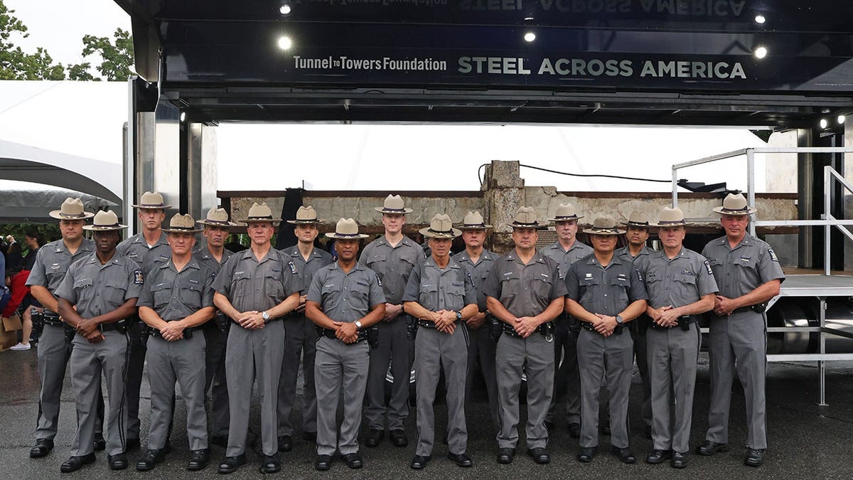 New York State Police stand with World Trade Center steel beam at West Point