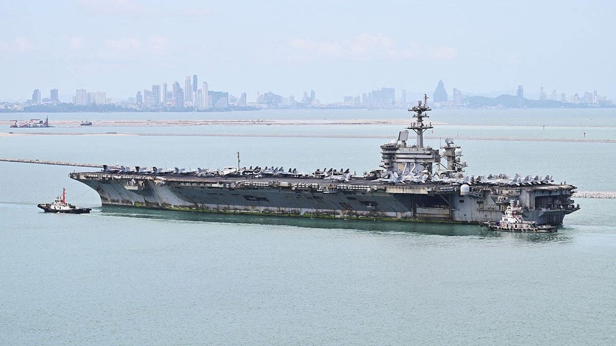 USS Abraham Lincoln aircraft carrier sails near Laem Chabang Port in the Gulf of Thailand.
